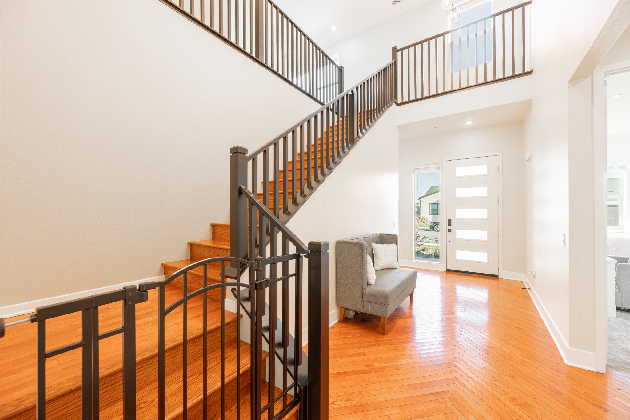 Butterfly Drive staircase and red oak hardwood interior